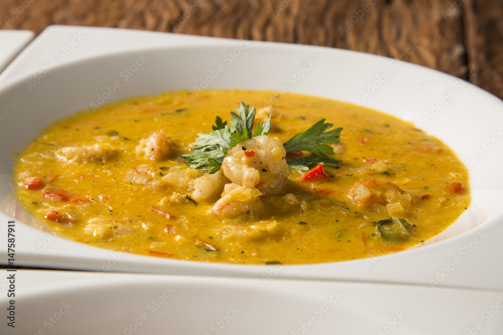 shrimp bobo - a Brazilian dish of shrimp in a pure of manioc meal and coconut milk. Bobo de camarao. shrimp bobo - a Brazilian dish of shrimp in a pure of manioc meal and coconut milk. Bobo de camarao.