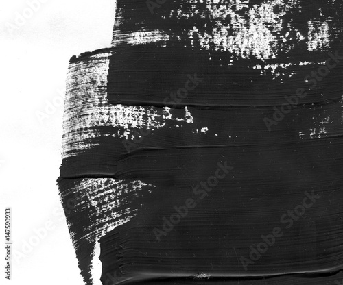 Geometric graffiti abstract background. Wallpaper with oil watercolor effect. Black acrylic paint stroke texture on white paper. Scattered mud art. Macro image. Hand made grunge backdrop.