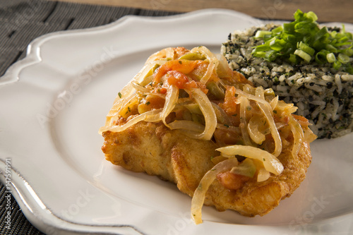 fish steak with sauce and cuxa rice