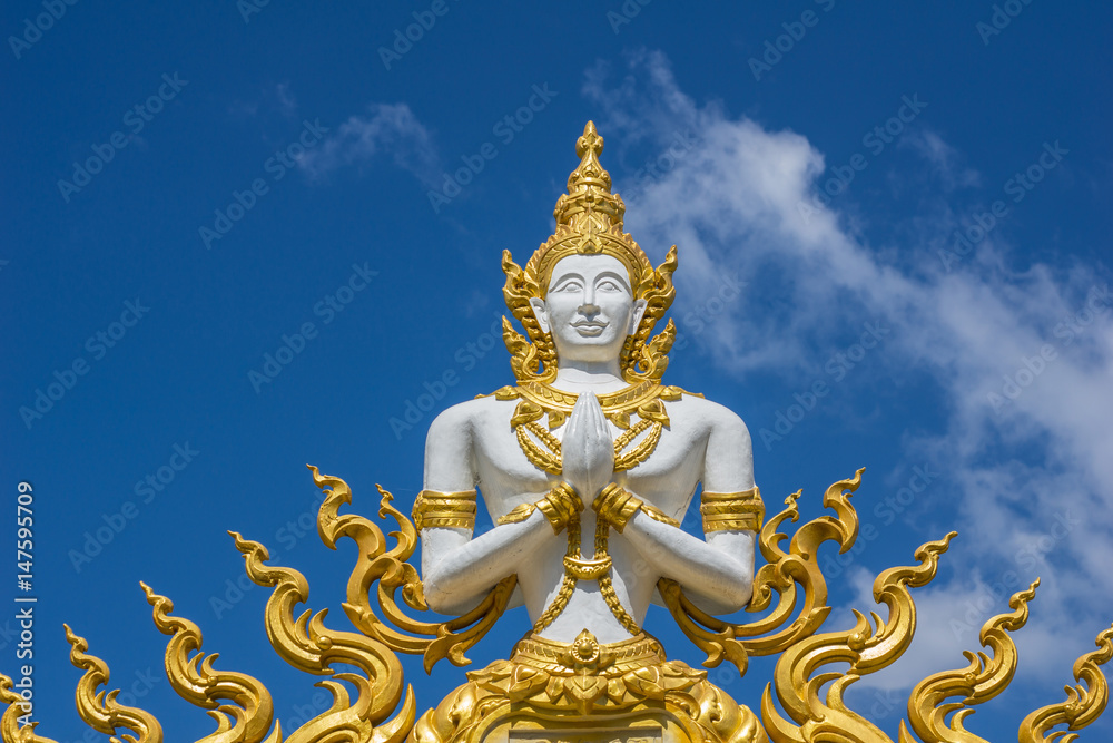 Fototapeta premium White Angel Buddha statue on the Wat wall thailand