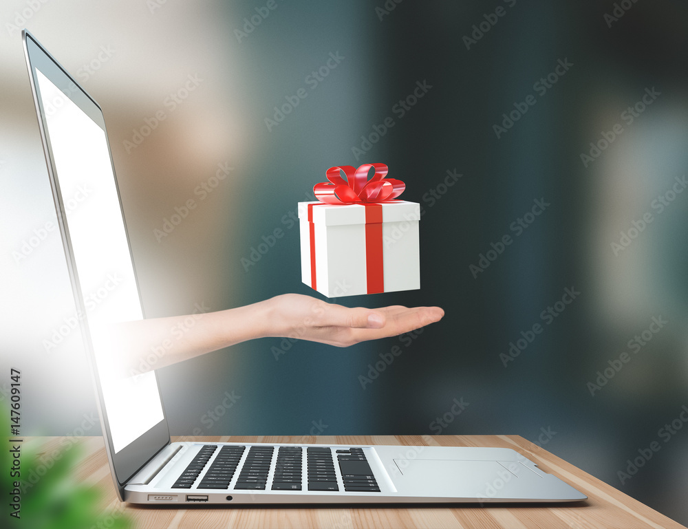 Illustrazione Stock Mano con pacco regalo esce dal monitor pc | Adobe Stock