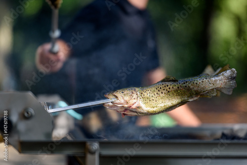 Canvas Print Fish in heat - German Steckerlfisch on the grill