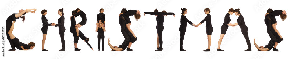 Black dressed people forming word CHRISTMAS Black dressed people forming word CHRISTMAS