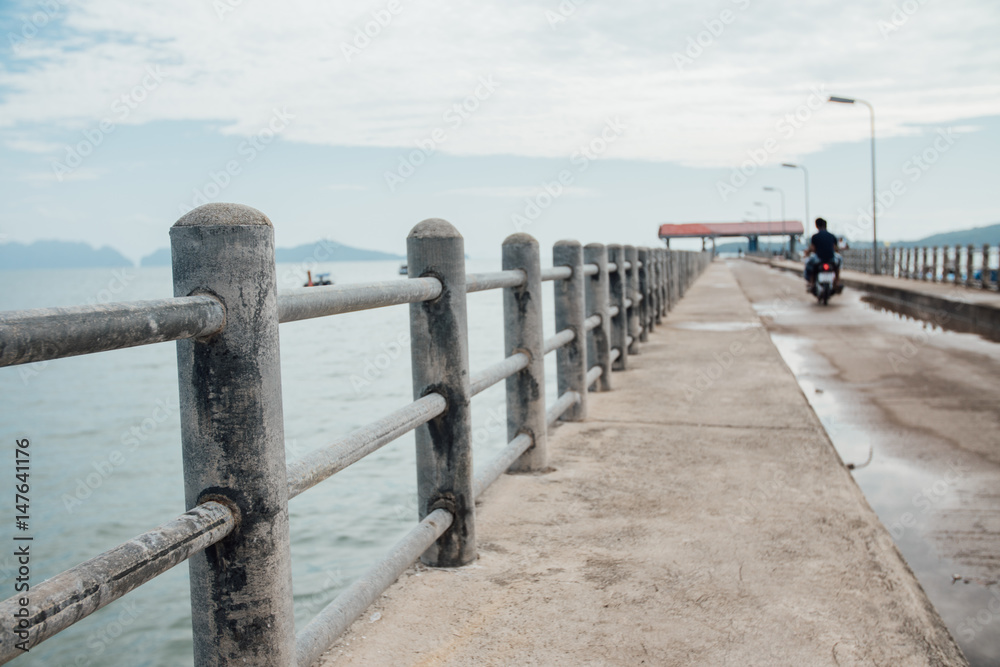 Handrail on the pier on the background of the sea. Thailand asia.