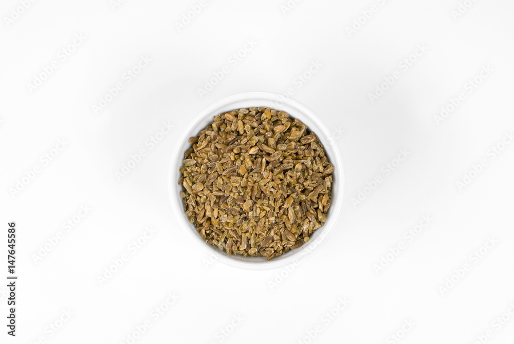 Freekeh in a ramekin in white background seen from above Freekeh in a ramekin in white background seen from above