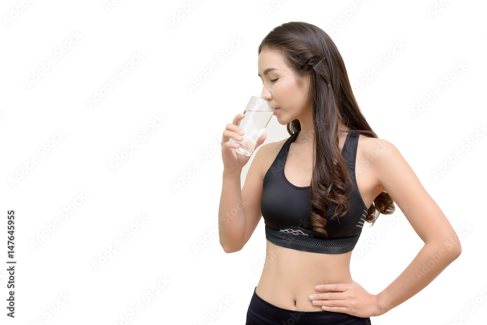 Beautiful Young Sporty Woman Drinking Water After Workouts Isolated on White Background - Sport and Healthcare Concept Beautiful Young Sporty Woman Drinking Water After Workouts Isolated on White Background - Sport and Healthcare Concept