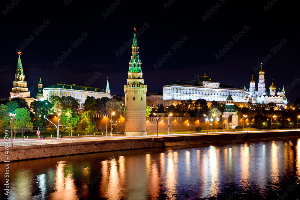 Moscow Kremlin at night. Embankment with car traffic view
