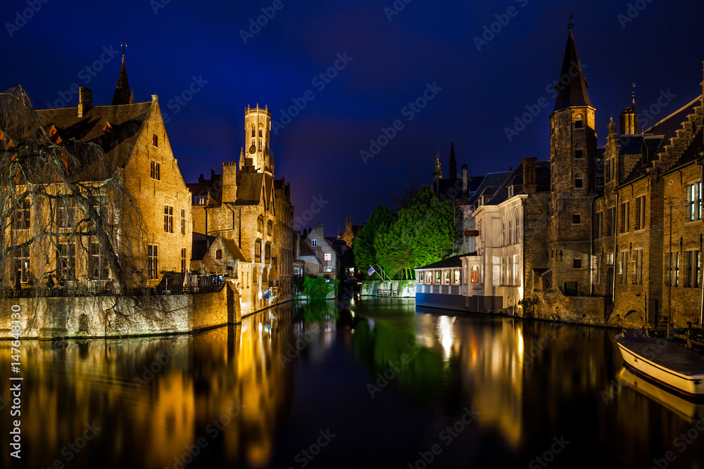 Night view of famous Bruges city view, Belgium, nightshot of Brugge canals, houses on Belfry canal