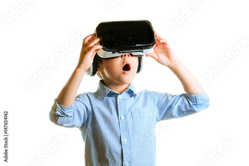 Children experiencing virtual reality isolated on white background. Surprised little boy looking in VR glasses.