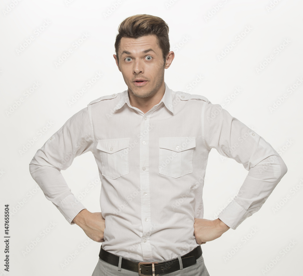 Handsome young man making furious face, isolated on white Handsome young man making furious face, isolated on white