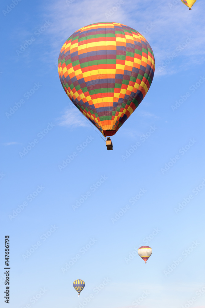Many balloons over the extraordinary rocks formations rock hills in Cappadocia, Nevsehir, Turkey. Many balloons over the extraordinary rocks formations rock hills in Cappadocia, Nevsehir, Turkey.