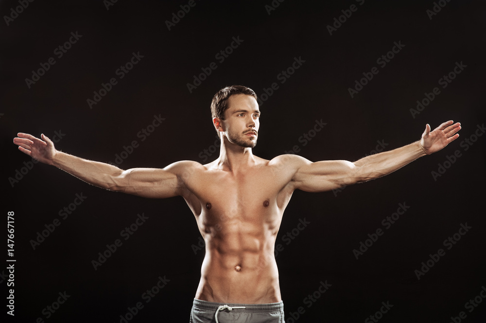 Young man athlet muscle body portrait in gym