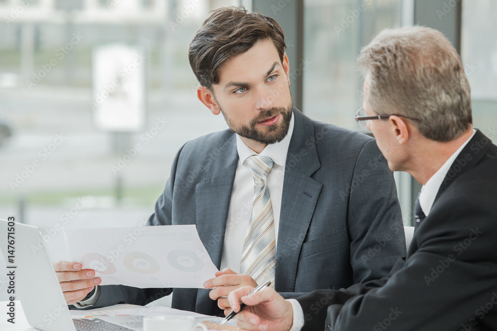 Stylish businessmen working in office Stylish businessmen working in office
