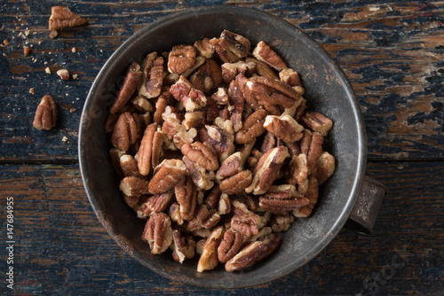 Chopped Pecans in a Tin Bowl
