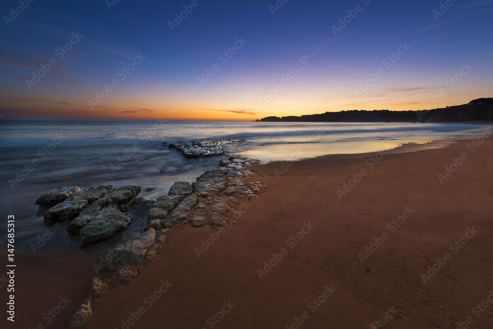 View of the Vau Beach (Praia do Vau) at sunset in Portimao, Algarve, Portugal; Concept for travel in Portugal and Algarve