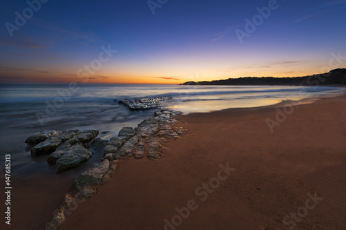 View of the Vau Beach (Praia do Vau) at sunset in Portimao, Algarve, Portugal; Concept for travel in Portugal and Algarve