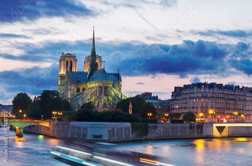 Notre Dame cathedral church and Cite island at night, Paris, France