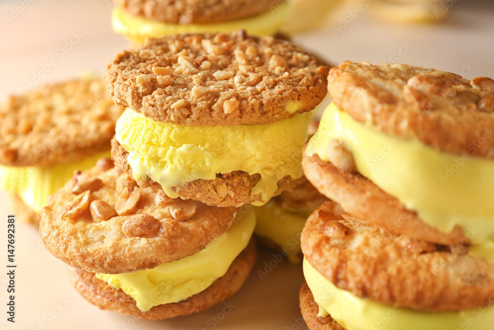 Delicious lemon ice cream cookie sandwiches on kitchen table, closeup Delicious lemon ice cream cookie sandwiches on kitchen table, closeup