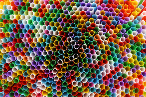 Many colorful straws for drinks as background
