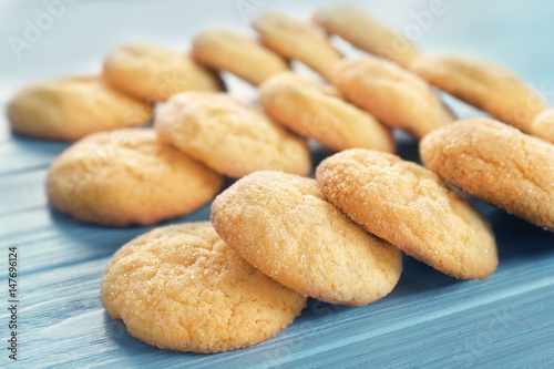 Tasty sugar cookies on wooden table