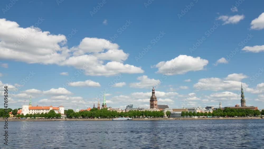 Latvia. Clouds move on the blue sky over Riga and Daugava river.Timelapse Latvia. Clouds move on the blue sky over Riga and Daugava river.Timelapse