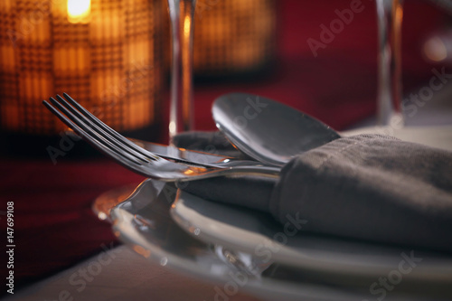 Cutlery set on plate, closeup