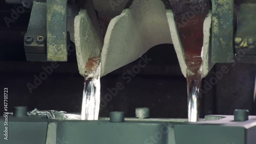 close-up of making engine, molten aluminium is casting in form of car engine in car factory