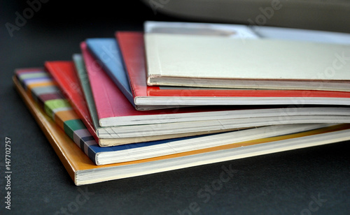 Stack of brochures; information, education and object concept; selective focus.