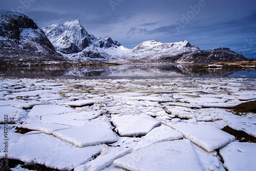 Ice on a mountain lake. Spring in the Lofoten Islands © FoodAndPhoto