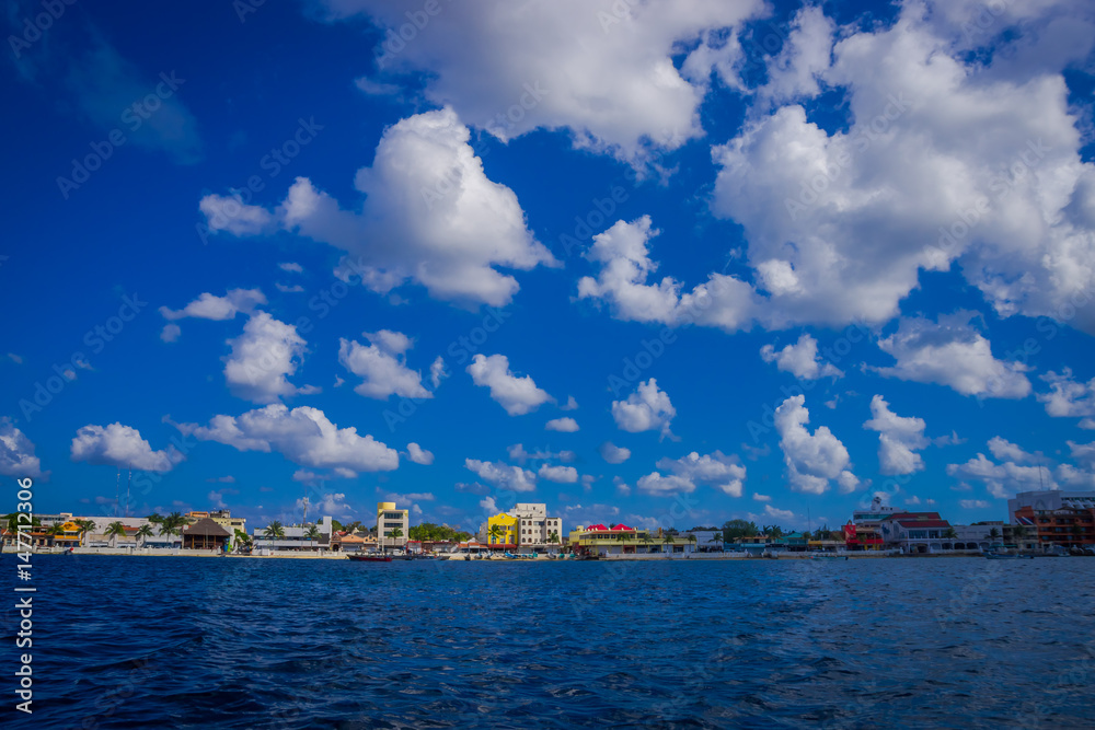 Beautiful port of Cozumel with some boats and buildings behind