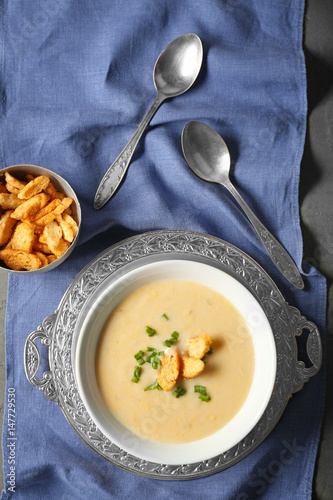 Delicious cream soup on table, top view photo