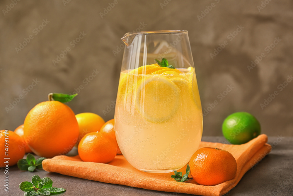 Glass with refreshing citrus fruits cocktail on grunge background Glass with refreshing citrus fruits cocktail on grunge background