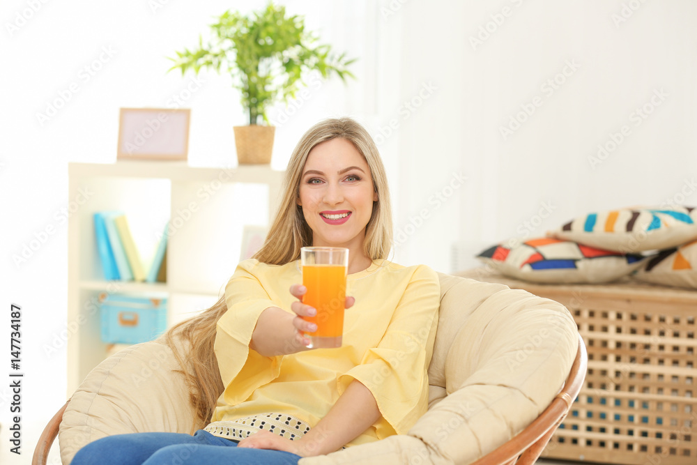 Beautiful young woman with glass of fresh juice at home Beautiful young woman with glass of fresh juice at home