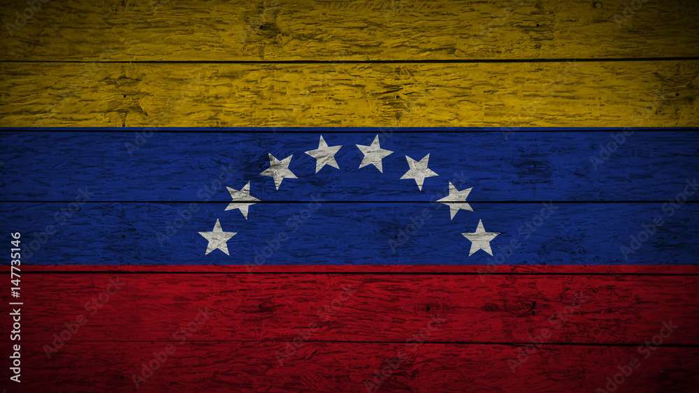 Flag of Venezuela Painted on old wood boards. wooden Venezuela flag. Abstract flag background for your text or logo. grunge Venezuelan flag. Flag of Venezuela Painted on old wood boards. wooden Venezuela flag. Abstract flag background for your text or logo. grunge Venezuelan flag.