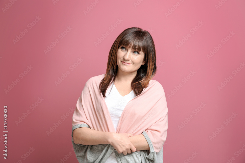 Beautiful mature woman on color background Beautiful mature woman on color background