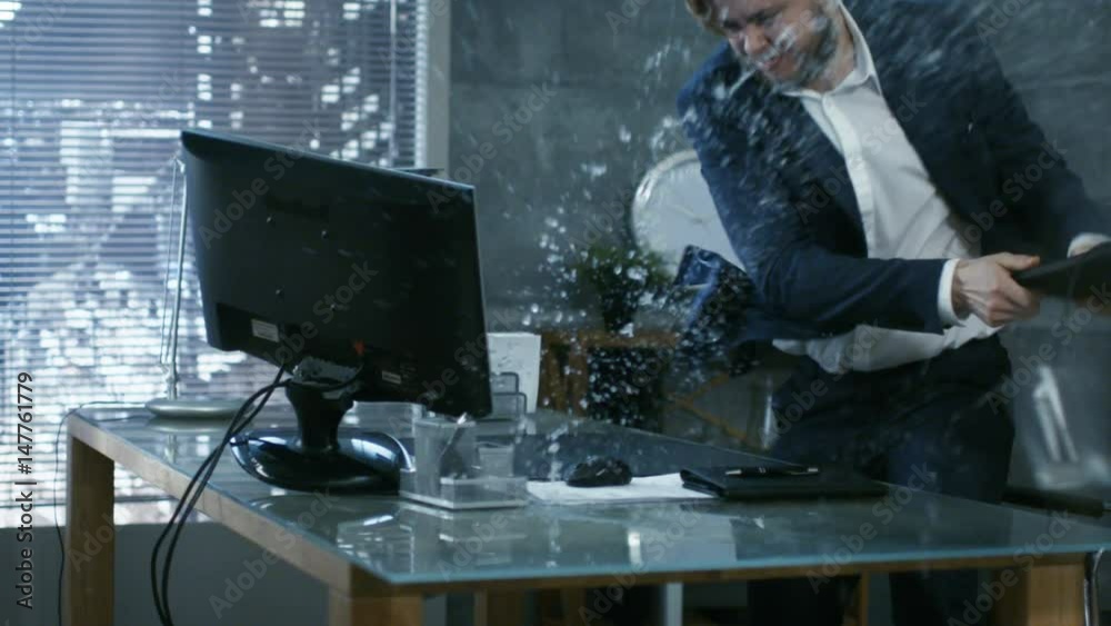  In a Private Office Businessman Loses Temper and Hits His Monitor With Keyboard, in an Act of a Rage Throws everything off the Table.  Shot on RED EPIC-W 8K Helium Cinema Camera.