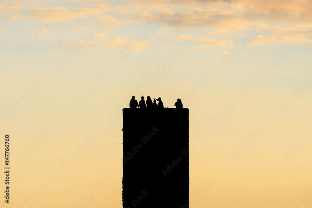 Fototapeta premium Cinque Terre Doria castle tower in Vernazza in Italy on sunset in summer with lot of turists on the top