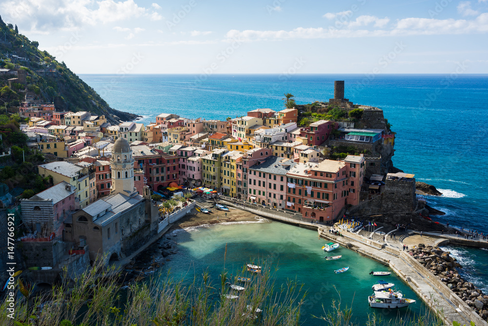 Colorfull Cinque Terre Vernazza turistic harbor view in sunny summer day in Italy