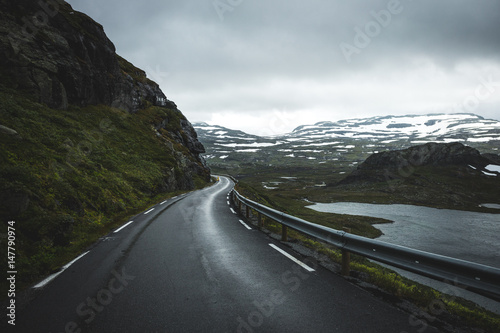 Scenic view of road passing by river