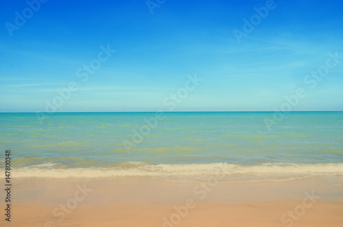 Wave   Sand beach with blue sky background  