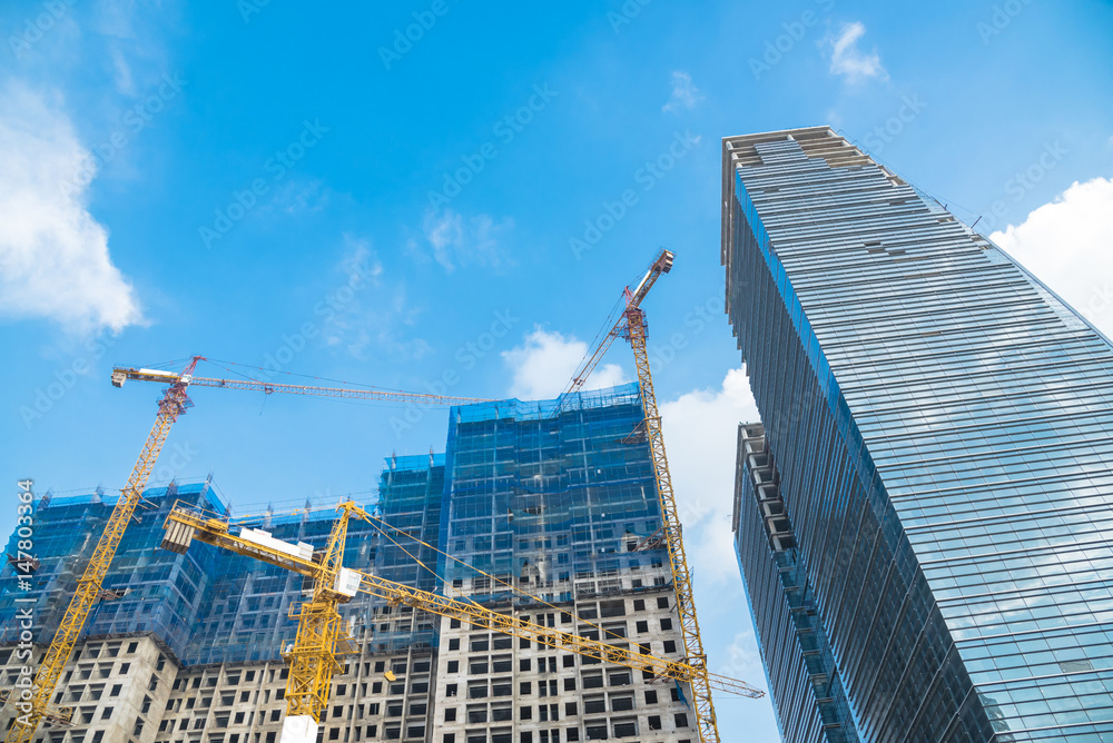 Construction site next to modern office, residential building. Working ...