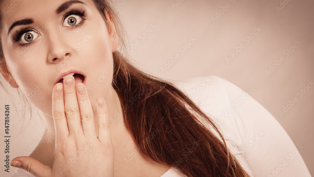 Shocked amazed woman covering mouth with hands Shocked amazed woman covering mouth with hands