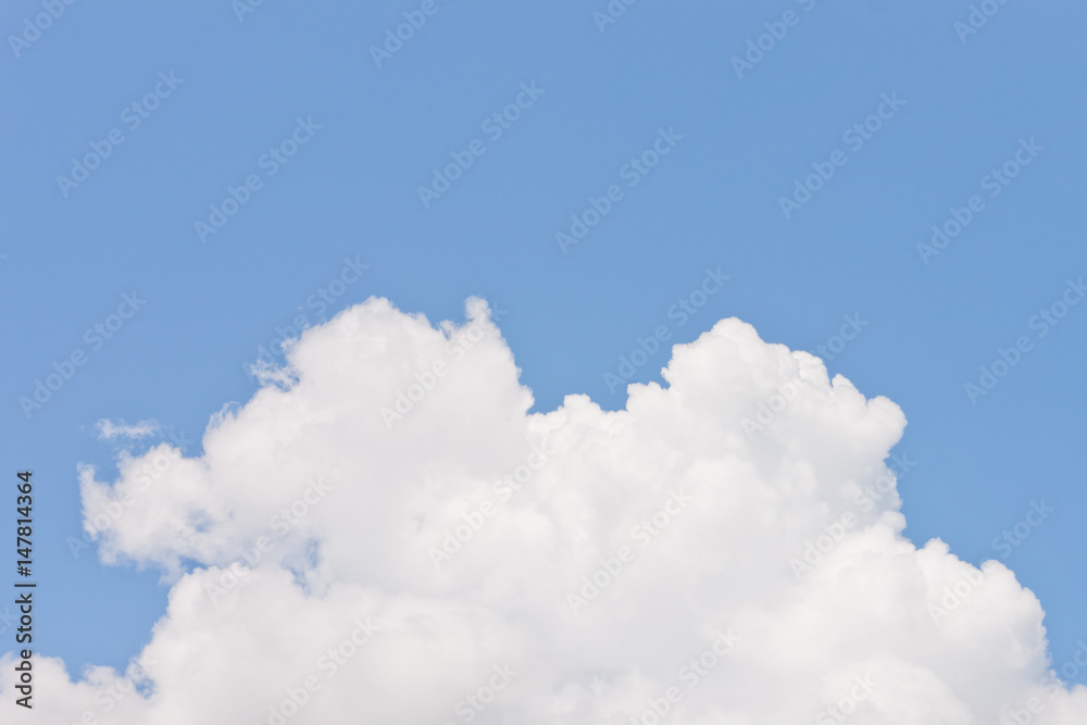 Lump of white fluffy cloud on blue sky background Lump of white fluffy cloud on blue sky background