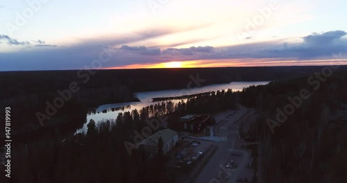 Haltia, Cinema 4k aerial rising view infront of haltia, pitkajarvi and solvalla, at a sunset, in nuuksio national park, on a sunny spring evening, in Espoo, Finland photo