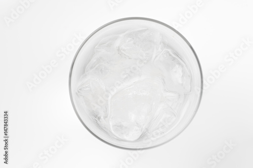 glass of soda with ice blocks isolated on white background, top view