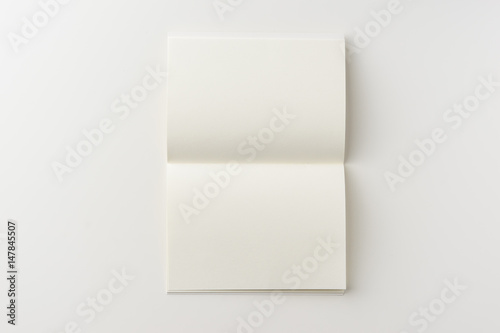 Business concept - Top view of blank notebook on white background desk for mockup