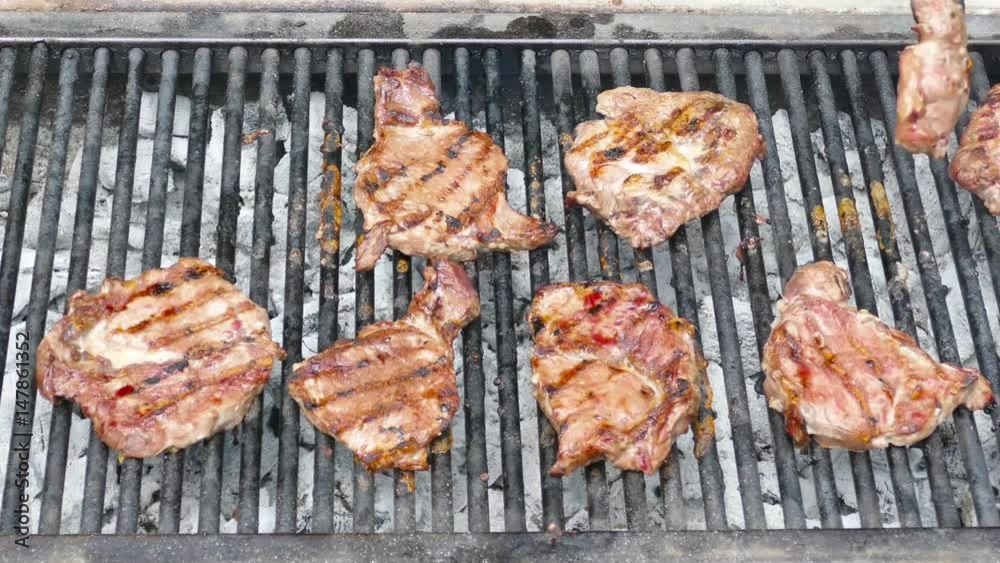 Small coal grill with Porterhouse steaks Small coal grill with Porterhouse steaks