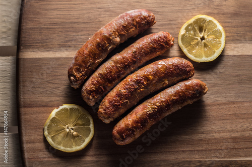 Hot spicy calabrian sausage on the grill photo