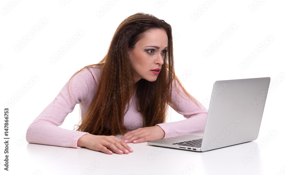 woman looking at her laptop. Isolated woman looking at her laptop. Isolated