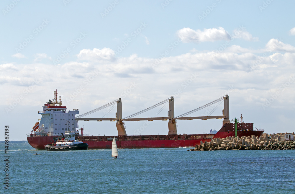 Vessel and Tugboat  Entering Harbor in Durban